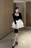 Stylish Black and White Dress with Halter Neck and Layered Skirt