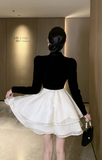 Stylish Black and White Dress with Halter Neck and Layered Skirt